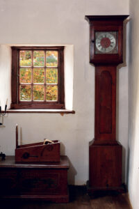 Displayed in the Bakery at Ephrata Cloister, a clock made by Hessian emigrant John George Hoff Sr. of Lancaster is housed in a case that was probably made by the Brothers around 1775. Collection, Ephrata Cloister; photo, Pennsylvania Historical & Museum Commission