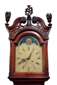Ephrata Householder Jacob Gorgas made this 8-day brass movement clock, circa 1770, for his brother-in-law William DeShong, whose name is painted on the dial and his initials inlaid above the pendulum door of the Chippendale-style case. Collection, Historical Society of the Cocalico Valley (Gift of William Fishburn); photos, Pennsylvania Historical & Museum Commission