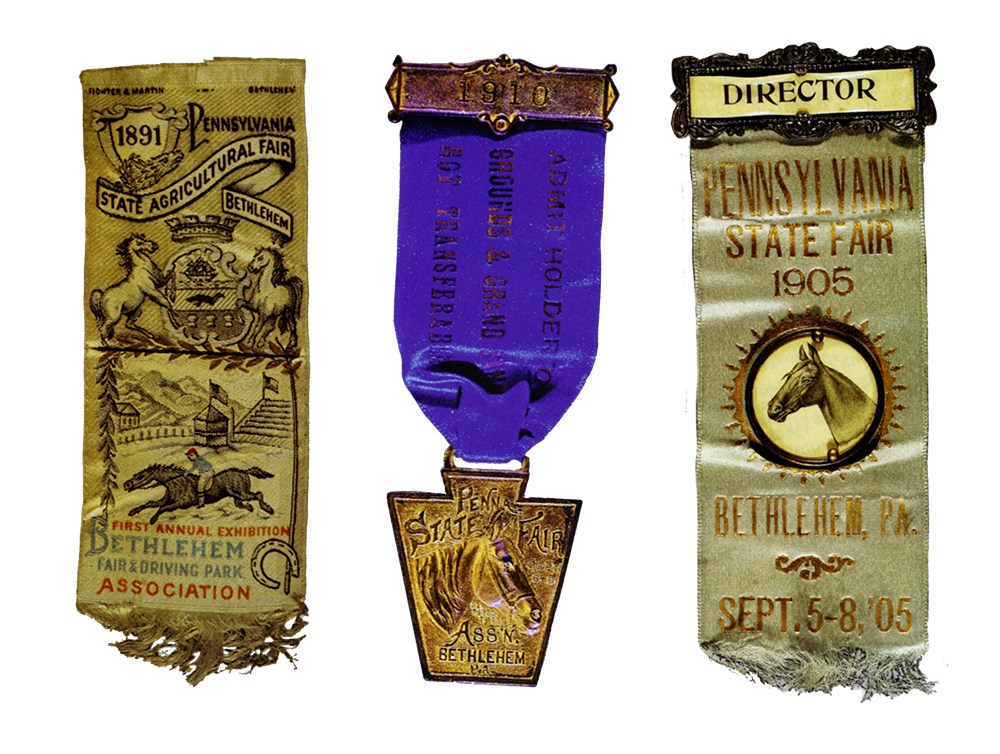 Decorative admissions badges from State Agricultural Fairs, Bethlehem, including, left to right, the fair's first badge, 1891 ; a blue ribbon-style badge, 1910; and a V.I.P. badge, 1905. The State Museum of Pennsylvania