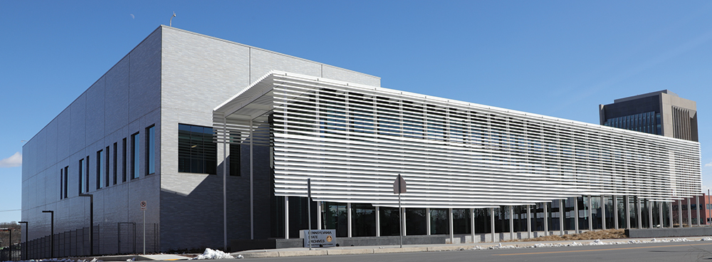 This view of the State Archives building shows the four-story, windowless storage area along Hamilton Street to the left and the sprawling glass portion, with solar shade, along 6th Street, which houses the staff and public viewing areas. Photo, Daniel R. Vodzak