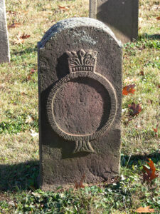 Among the “blank” gravestones at Muddy Creek Lutheran Cemetery is this one with an elaborate carving of the Crown and Ring that likely had a painted inscription in its center. Photo, Patrick J. Donmoyer