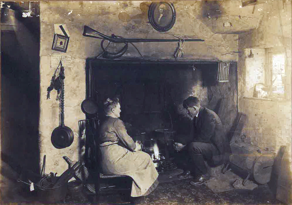Christian Sanderson, seated with his mother, enjoyed having a fire in the Washington’s Headquarters fireplace while he graded his student’s papers. In the room are a portrait of George Washington and other Colonial Era items. Brandywine Battlefield Park, Pennsylvania Historical & Museum Commission