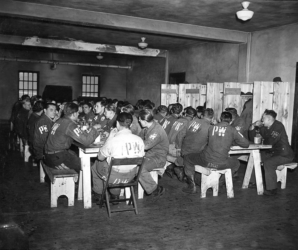 Prisoners of war at Camp Reynolds in Pymatuning Township, in Pennsylvania’s Mercer County, gather in the mess hall for a meal. ACW Productions