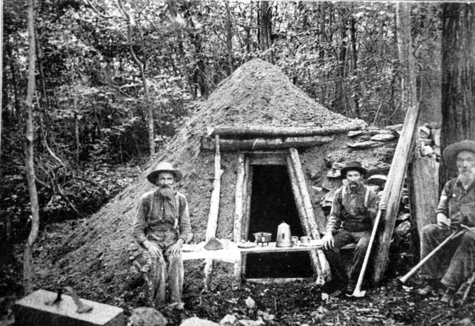 Three charcoal burners, or colliers, rest in front of the hut they shared near the charcoal pits in a photo from the late 19th century. From Report of the Pennsylvania Department of Forestry for the Years 1905 and 1906 (Harrisburg, PA: Harrisburg Publishing Co., 1907)