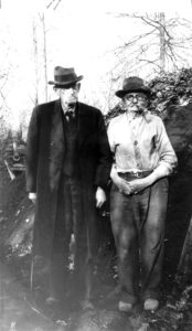 Standing left to right are Harker Long, final furnace manager of Hopewell Furnace, and Lafayette Houck, Hopewell’s last collier who began the charcoal making demonstrations in 1936. Hopewell Furnace National Historic Site