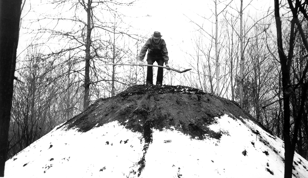 At early demonstrations, visitors might see a collier atop a charcoal pile “jumping the pit,” which involved jumping up and down on soft spots, or mulls, caused by shrinkage of the charring wood. This was considered a dangerous part of the job. Hopewell Furnace National Historic Site