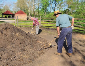 Colliers tend the pile, patching cracks as they develop. Photo, Suzanne Reisser