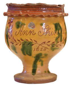 Redware pottery made from red clay with sgraffito designs is a traditional Pennsylvania German craft. Landis Valley Village & Farm Museum, Pennsylvania Historical & Museum Commission