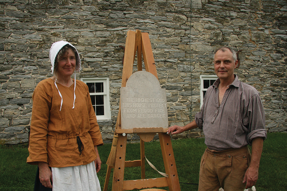 Marshall and Anne Rumbaugh exhibit a stone carving in this photograph taken at Heemet Fescht at Kutztown University in 2010. Pennsylvania German Cultural Heritage Center, Kutztown University