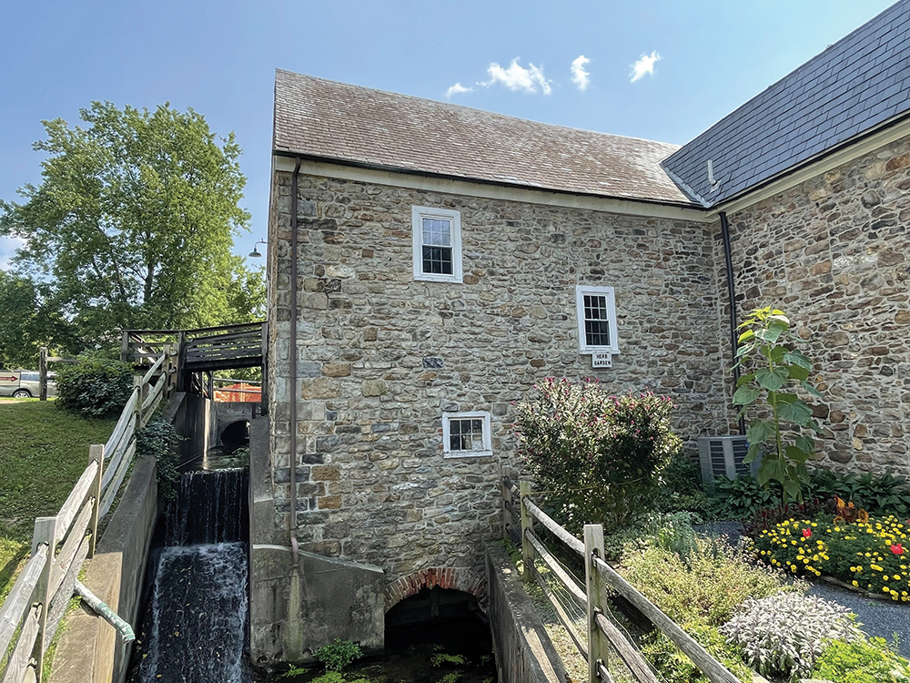 The north façade is the original section of the mill with the mill race waterfall and bridge. This area was heavily restored in the late 1980s. Artefact Inc.