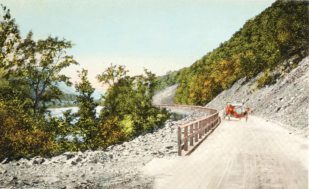 In a scene looking northwest a few miles from Mifflintown, the crude and barely paved William Penn Highway hugs the mountainside in the Lewistown Narrows near the Juniata–Mifflin county line. The Juniata River is on the left. Pennsylvania State Archives, MG-213
